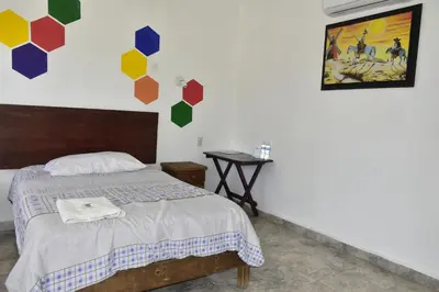 Cama o camas de una habitación en Hotel Bacaanda