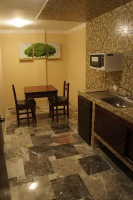 Una cocina o zona de cocina en Hotel Suites Teziutlan