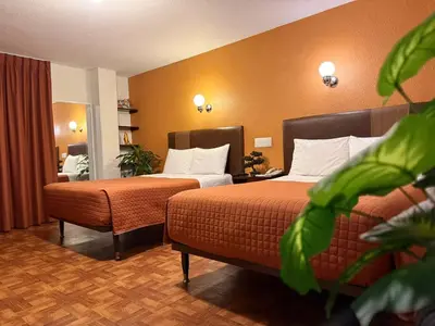 Cama o camas de una habitación en Hotel Suites Teziutlan