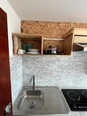 Una cocina o zona de cocina en HABITACION, VISTA AL MAR