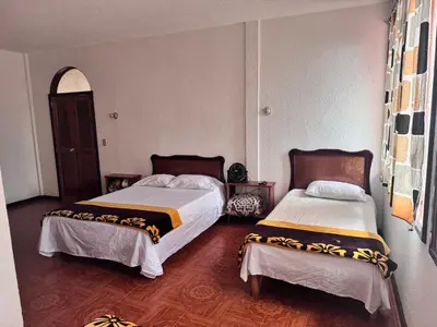 Cama o camas de una habitación en Posada Quetzalin