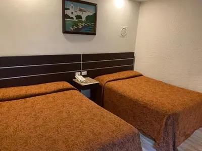 Cama o camas de una habitación en HOTEL MIRAMAR