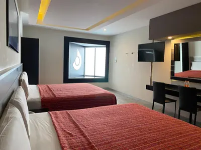 Cama o camas de una habitación en HOTEL MIRAMAR