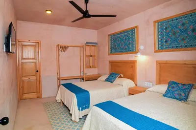 Cama o camas de una habitación en Hotel Mansión Chiapa