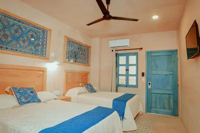 Cama o camas de una habitación en Hotel Mansión Chiapa