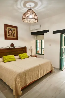 Cama o camas de una habitación en Hotel Mansión Chiapa