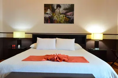 Cama o camas de una habitación en Hotel del Capitán de Puebla
