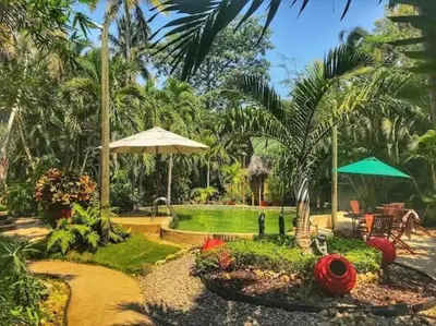 Jardín al aire libre en Villa Copa de Oro. Zona Diamante. Alberca Privada. Espacio Yocte