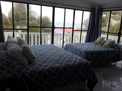 Cama o camas de una habitación en COCO HOUSE CHACHALACAS