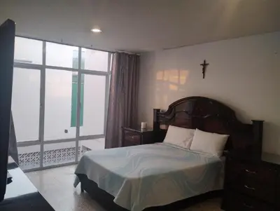 Cama o camas de una habitación en PROVENZA HOTEL & SUiTES