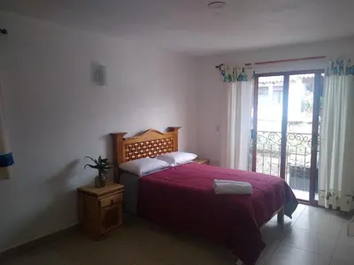 Cama o camas de una habitación en Hospedaje Anayauhcalli