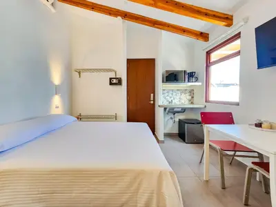 Cama o camas de una habitación en Niebla Suites