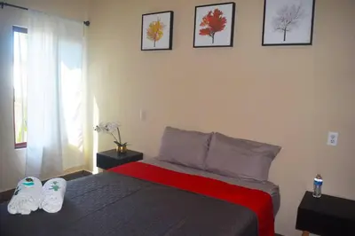 Cama o camas de una habitación en Casa Jumaya depto con dos habitaciones queen.
