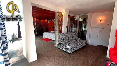 Cama o camas de una habitación en Hotel Temático Casa Puebla