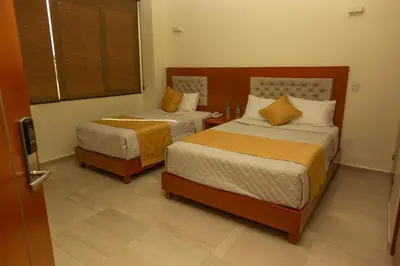 Cama o camas de una habitación en PH Hotel
