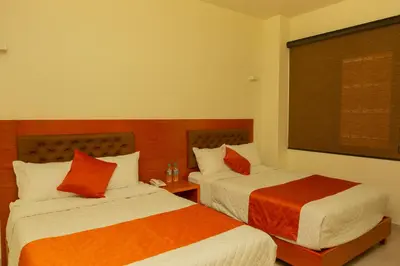Cama o camas de una habitación en PH Hotel
