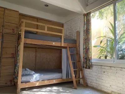 Cama o camas de una habitación en La Palmera Hostel