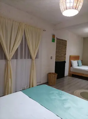 Cama o camas de una habitación en Alojamiento el nixtamal
