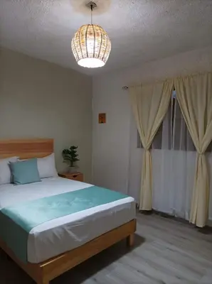 Cama o camas de una habitación en Alojamiento el nixtamal