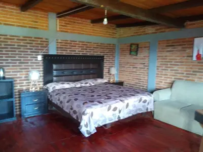 Cama o camas de una habitación en CABAÑA Adán y Eva en Zacatlán