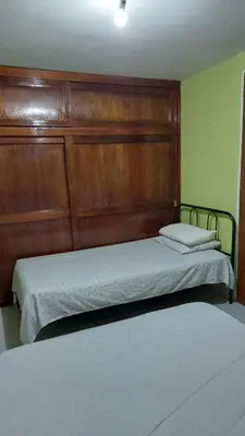 Cama o camas de una habitación en Relajacion Cercas Del Aeropuerto