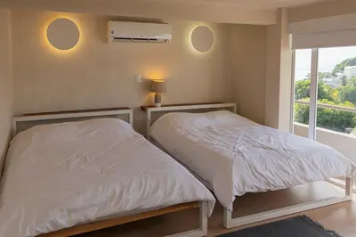 Cama o camas de una habitación en Casa con vista a la bahía