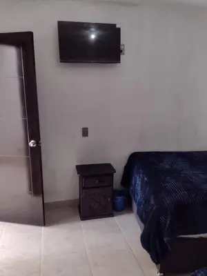 Una televisión o centro de entretenimiento en Hotel OCLAS