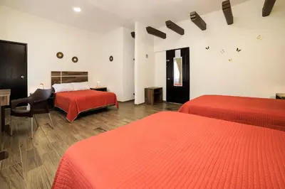 Cama o camas de una habitación en Capital O Hotel Boutique Las Torres