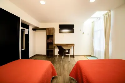 Cama o camas de una habitación en Capital O Hotel Boutique Las Torres