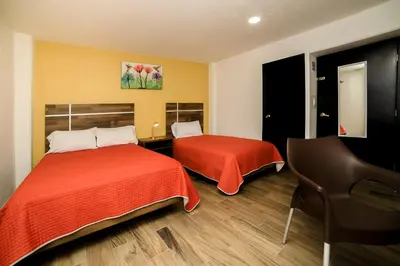 Cama o camas de una habitación en Capital O Hotel Boutique Las Torres