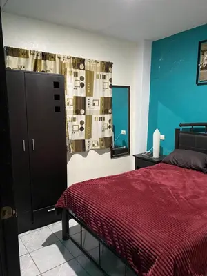 Cama o camas de una habitación en Bonito Departamento Verde con terraza