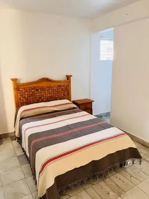 Cama o camas de una habitación en Habitaciones LEONOR