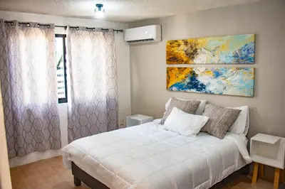 Cama o camas de una habitación en Departamento Olas