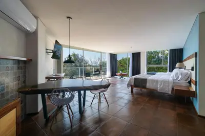 Cama o camas de una habitación en Hotel Balcón del Parque