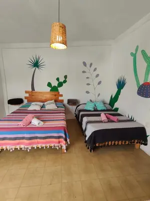 Cama o camas de una habitación en Hostel Casa Maguey