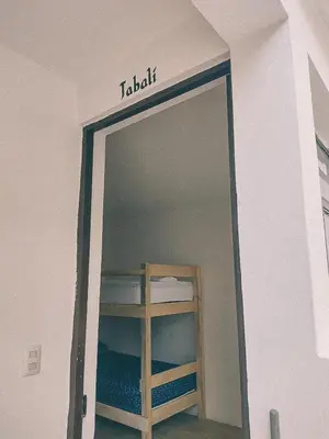 Cama o camas de una habitación en Hostel Casa Maguey