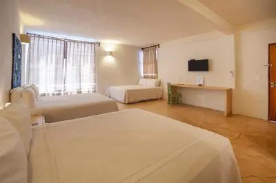 Cama o camas de una habitación en HOTEL BIULÚ