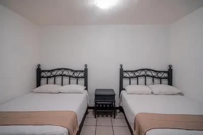 Cama o camas de una habitación en Marqués Oaxaca - Hotel