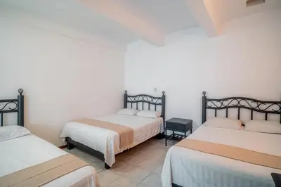 Cama o camas de una habitación en Marqués Oaxaca - Hotel