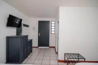 Una televisión o centro de entretenimiento en Marqués Oaxaca - Hotel
