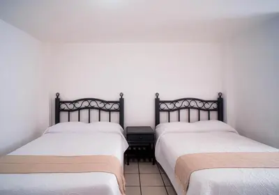 Cama o camas de una habitación en Marqués Oaxaca - Hotel