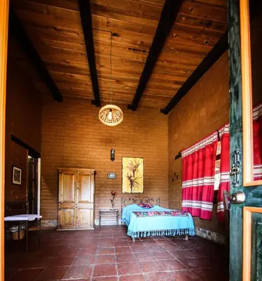Cama o camas de una habitación en Huayápam Yù'ú Lodge