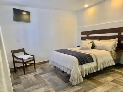 Cama o camas de una habitación en Hotel La Cofradía