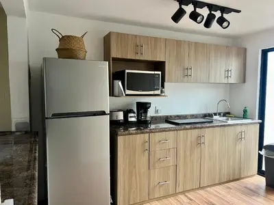 Una cocina o zona de cocina en Departamento Maderas