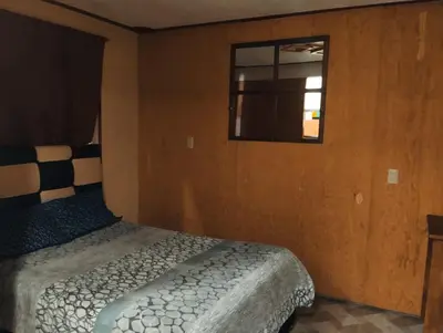 Cama o camas de una habitación en Hotel Nikko