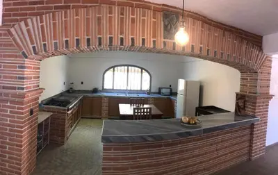 Una cocina o zona de cocina en Hostal Casa Flor de Limón