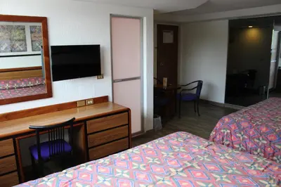 Una televisión o centro de entretenimiento en Hotel del Sur