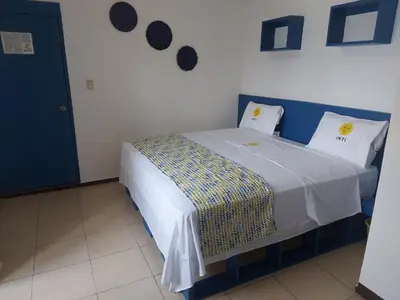 Cama o camas de una habitación en HOTEL INTI