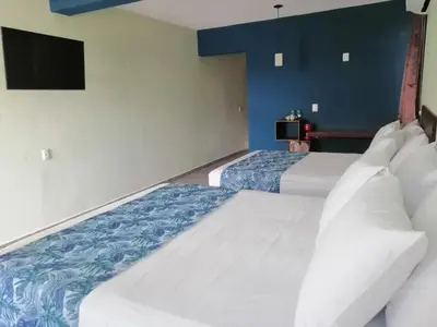 Cama o camas de una habitación en La Morada, una ventana al golfo - Hotel boutique