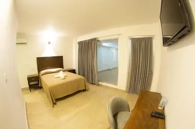 Una televisión o centro de entretenimiento en HOTEL REFORMA 14